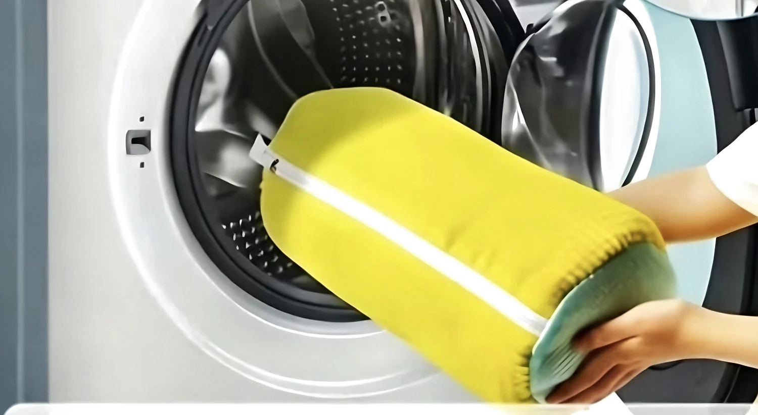 A SneakSuds bag going into a front-load washing machine